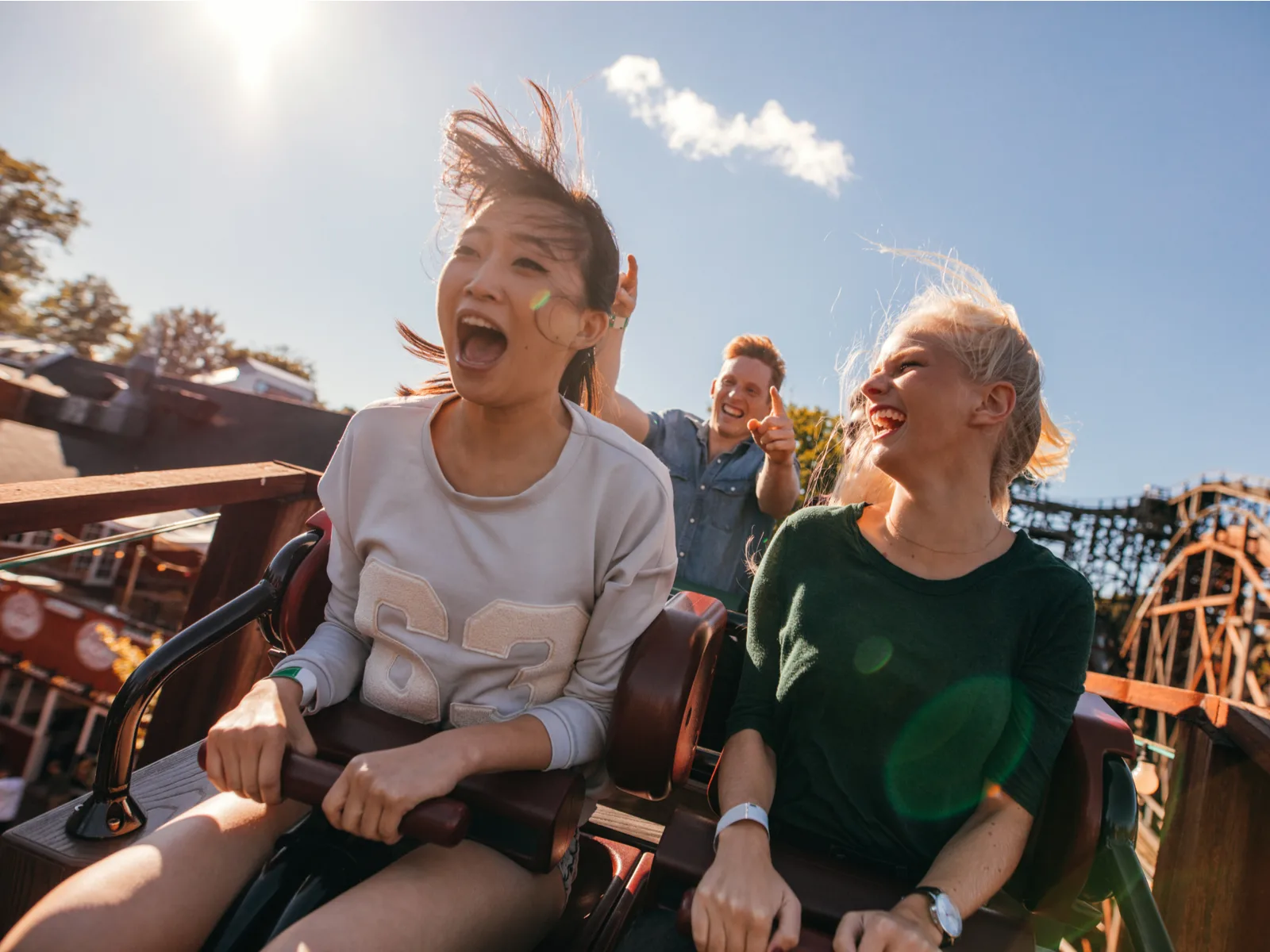 People at one of the best roller coaster parks in the United States looking excited