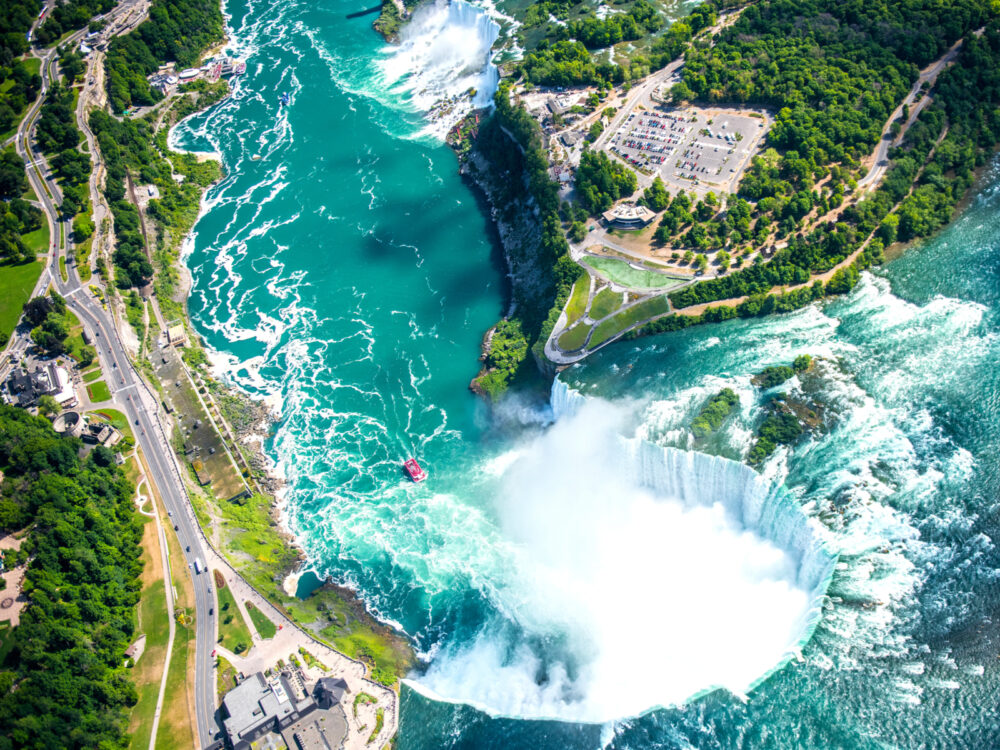 Overhead view looking down of the water and trees during the best time to visit Niagara Falls