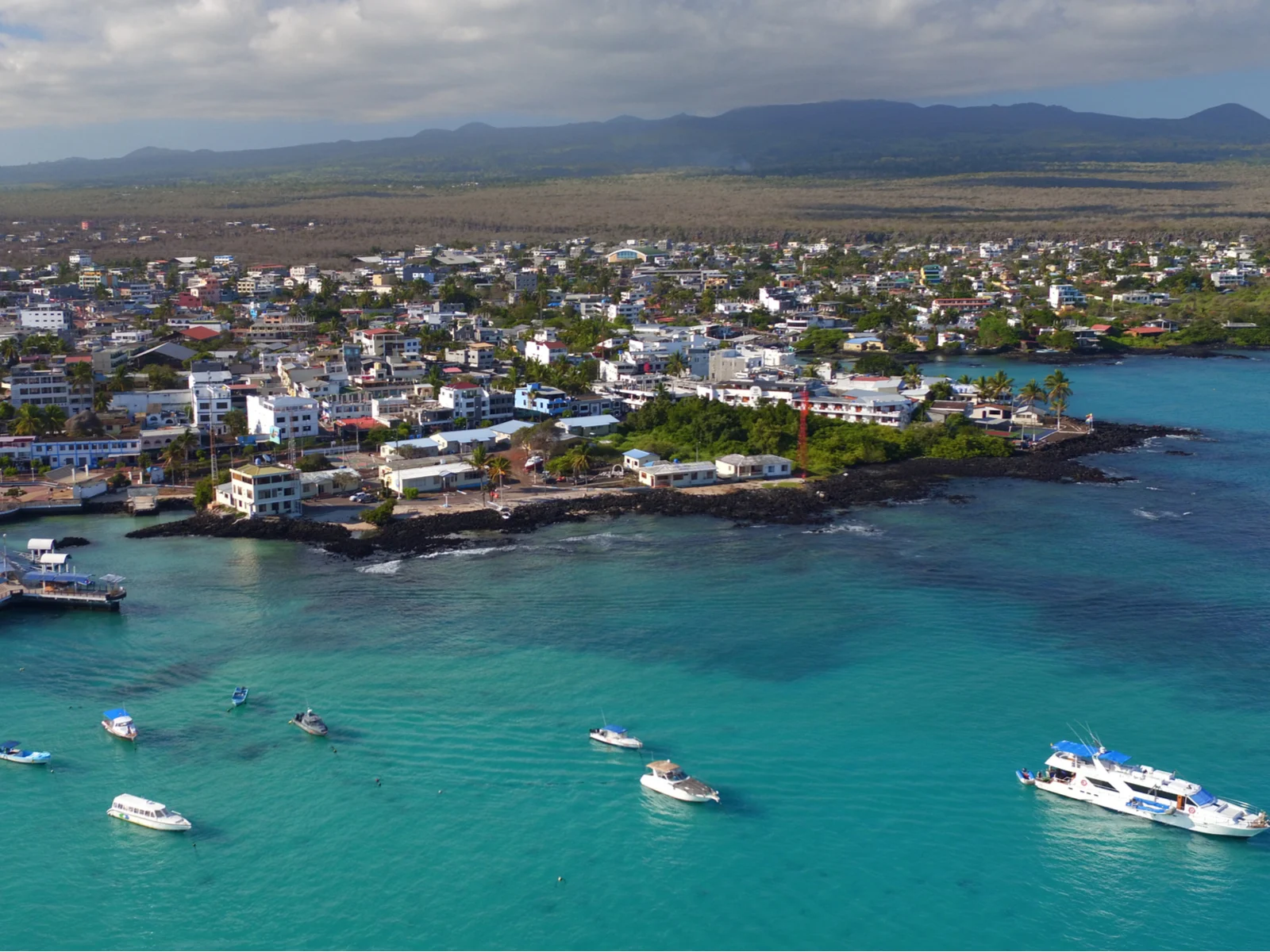 Drone shot of the Puerto Ayora city at Santa Cruz island pictured during the best time to visit the Galapagos Islands