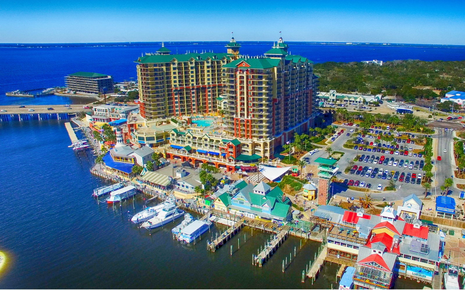 Aerial view of the downtown marina and skyline during the best time to visit Destin, Florida