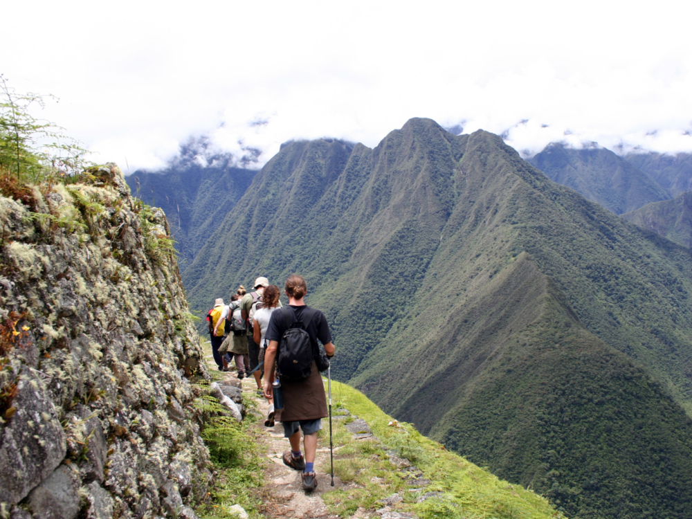 People walking the Inca trail through the Sacred Valley during the least busy time to visit Machu Picchu