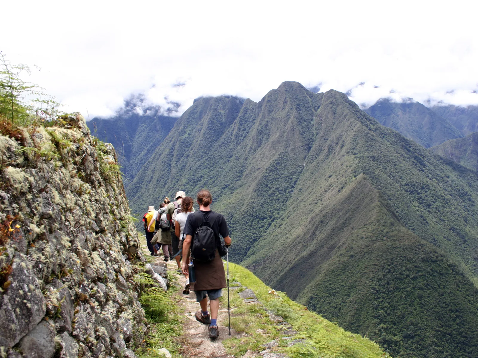 People walking the Inca trail through the Sacred Valley during the least busy time to visit Machu Picchu