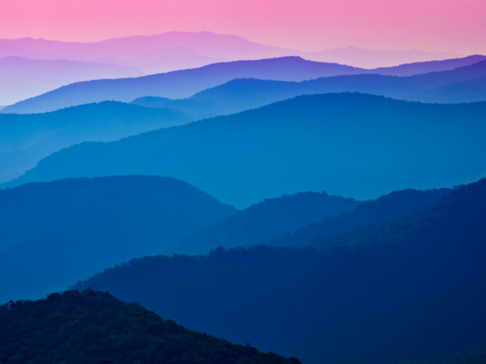 Scenic view at the Blue ridge parkway on a pink sky sunset, considered one of the most beautiful places in the US