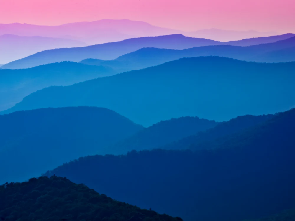 Scenic view at the Blue ridge parkway on a pink sky sunset, considered one of the most beautiful places in the US