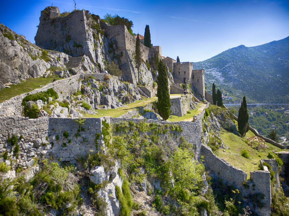 The medieval Fortress Klis in Croatia is one of the Game of Thrones filming locations you can visit in real life, situated on a sloppy mountain side