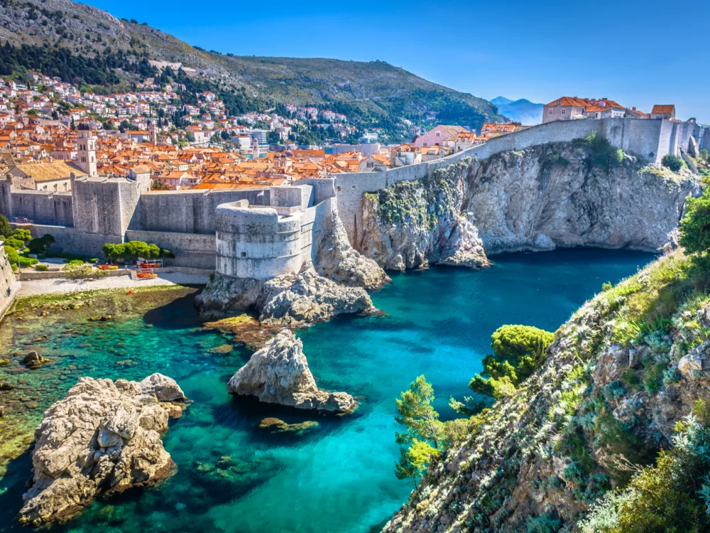 The beautiful old town of Dubrovnik in Croatia is one of the Game of Thrones filming locations you can visit, with crystal clear water on its coast