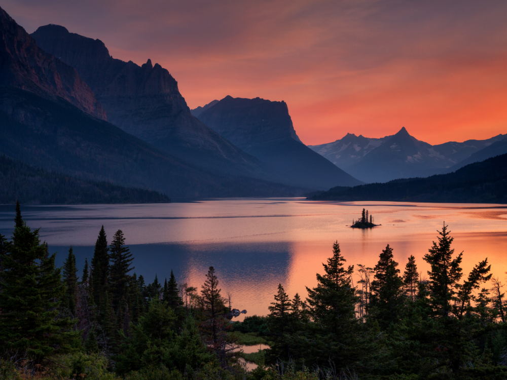 Goose Island in Glacier National Park pictured during the best time to visit Montana with a gorgeous dusk shot