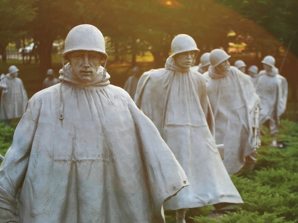 One of the best things to do in Washington, D.C. is visiting the marching statues of several soldiers wearing a raincoat and helmet in The Korean War Veterans Memorial located in National Mall 
