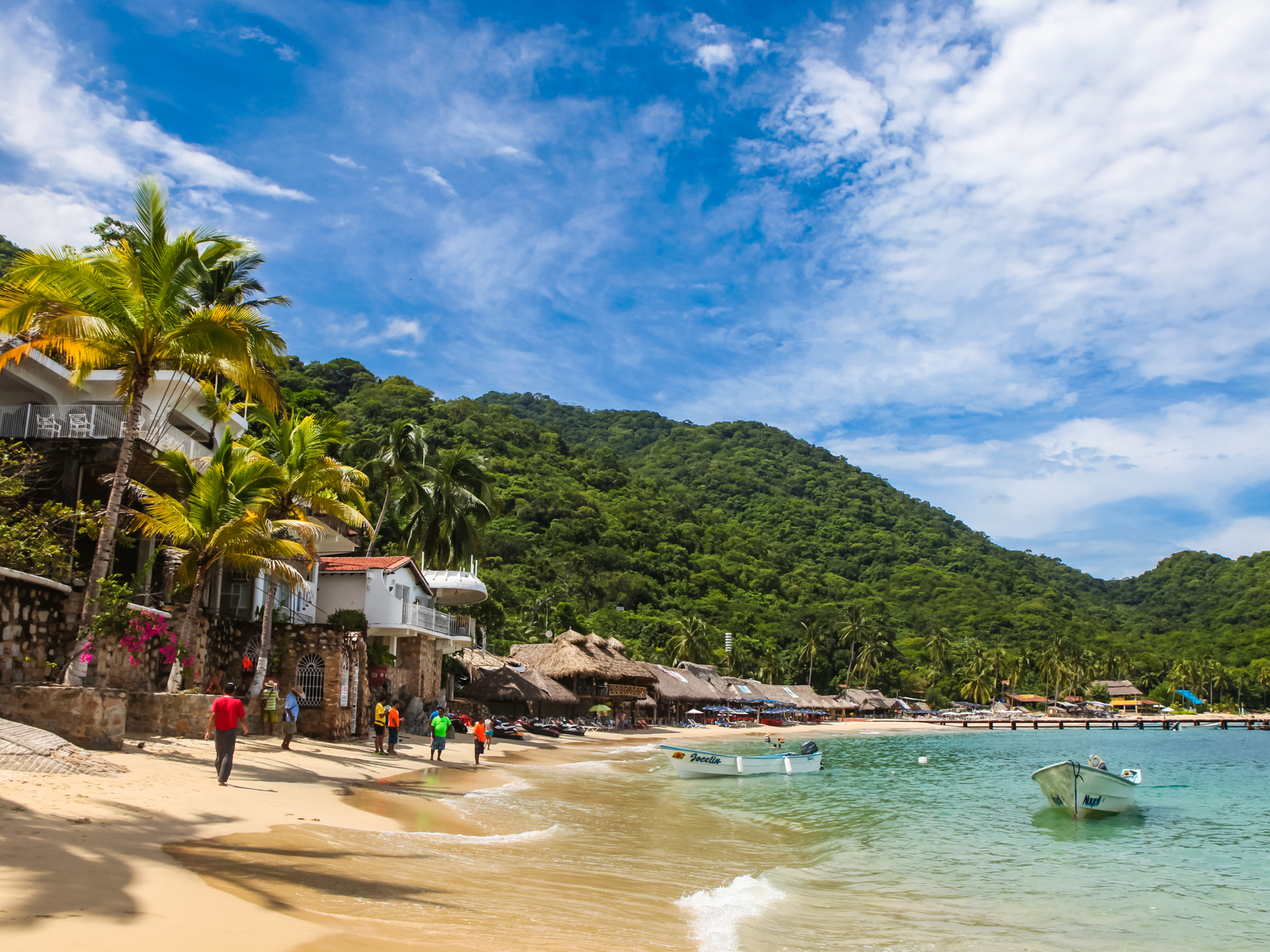 People at Playa Las Animas and gorgeous teal water during the best time to visit Puerto Vallarta