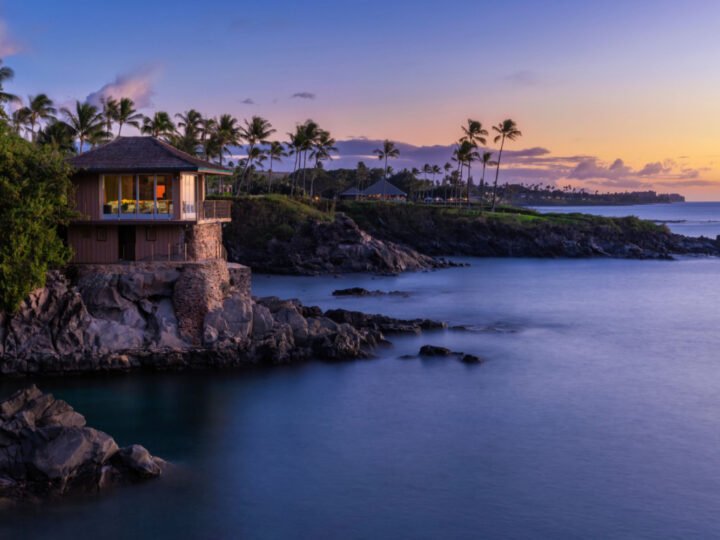 Featured image for a piece on the best Airbnbs in Maui featuring a house on the cliffside