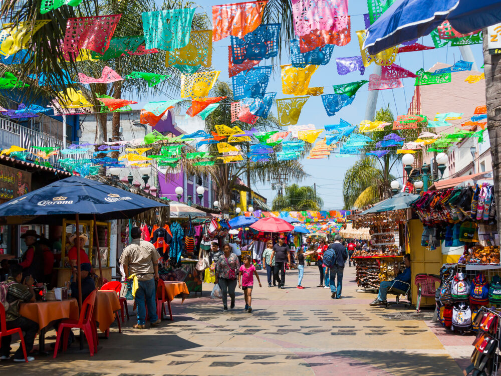 People shopping in an open-air market in Tijuana
