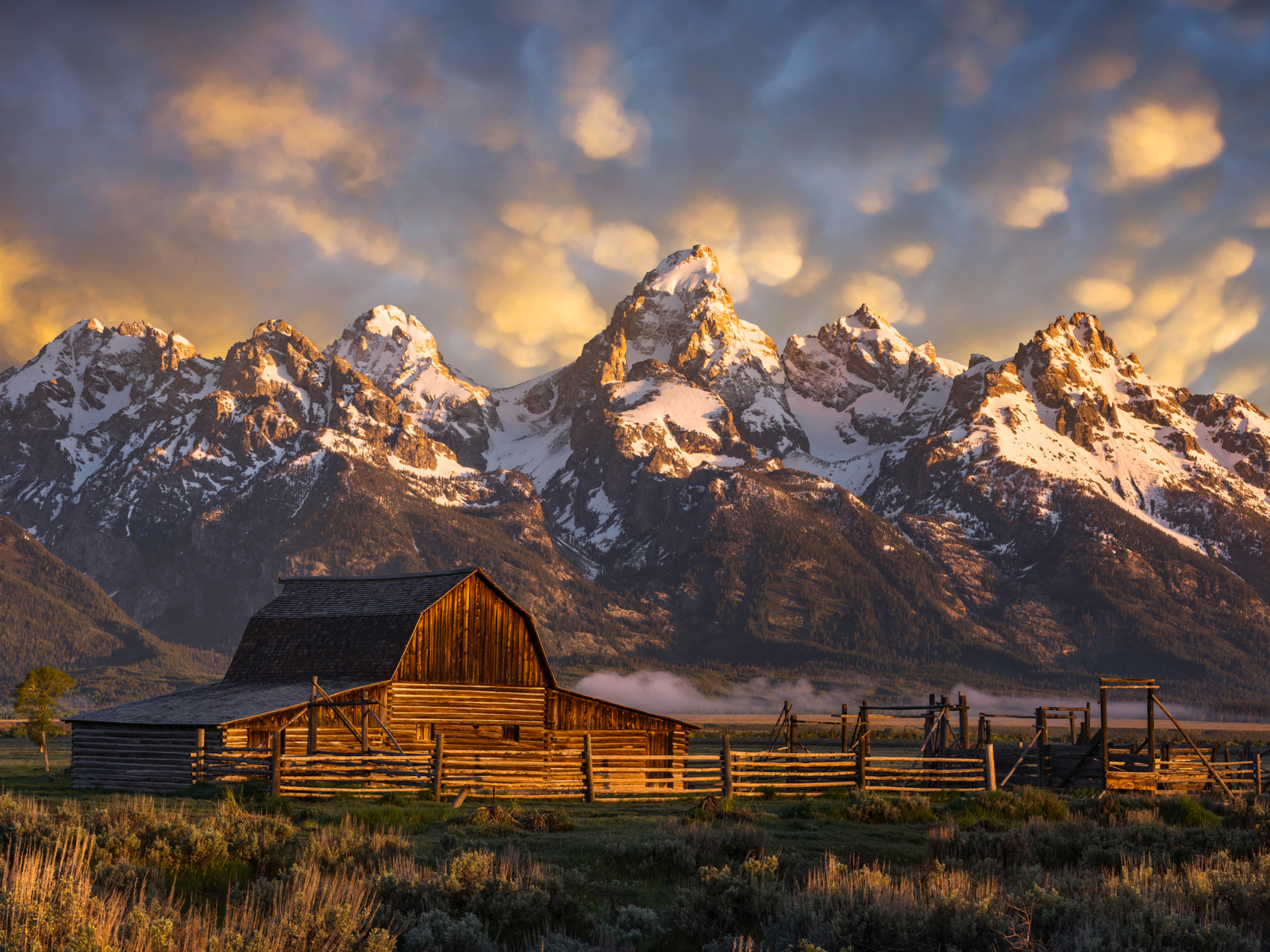 Image of a barn at the base of the Tetons during the best time to visit Grand Teton National Park