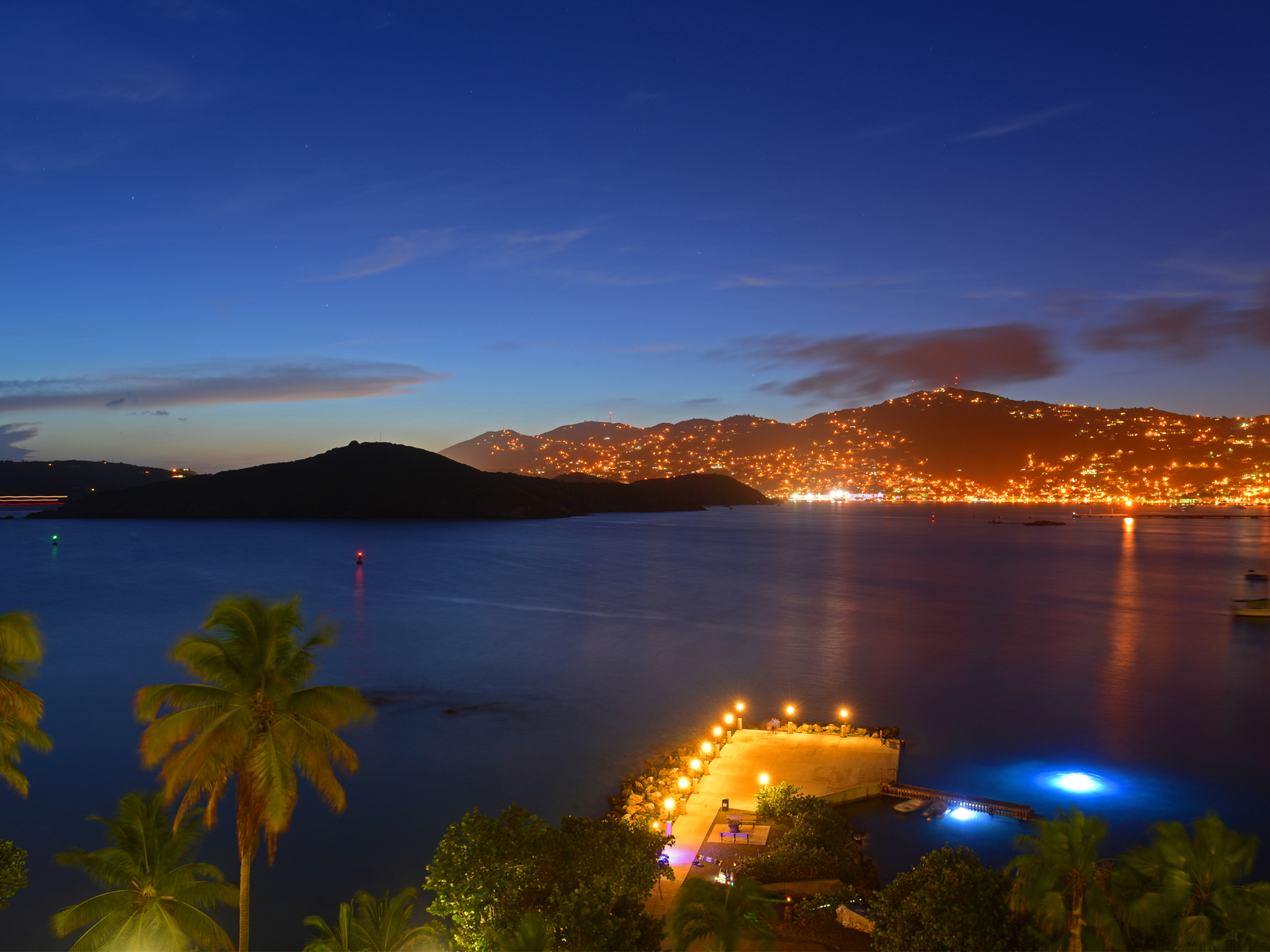 For a piece titled Is Saint Thomas Safe, a night photo of the bay with the hills lit up