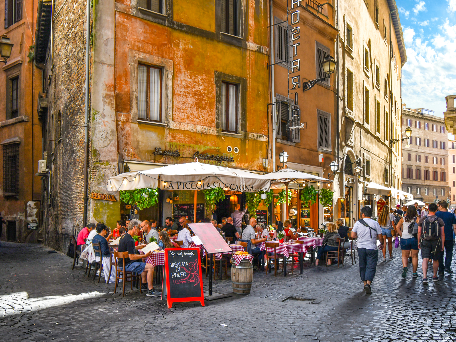 Cafe on an alleyway pictured during the best time to visit Rome