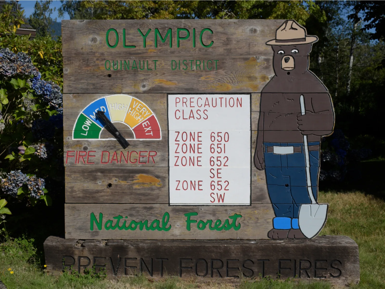 Sign showing the fire danger outside a park for a piece on the best time to visit Olympic National Park