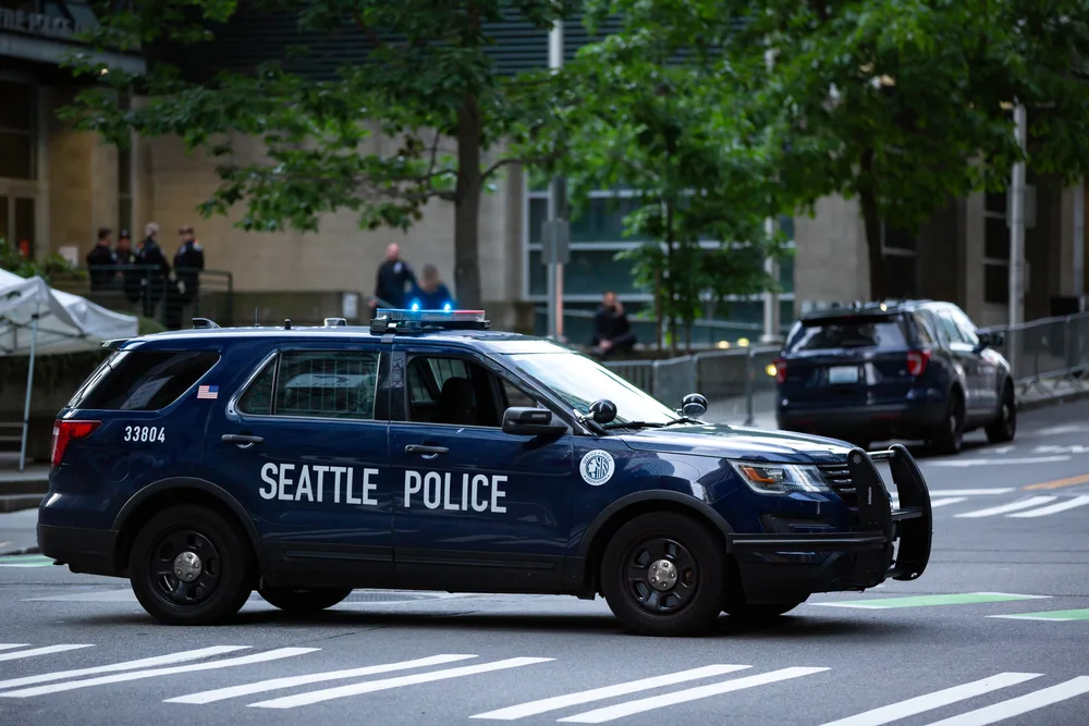Seattle police patrol car in the downtown area for a piece titled Is Seattle Safe to Visit