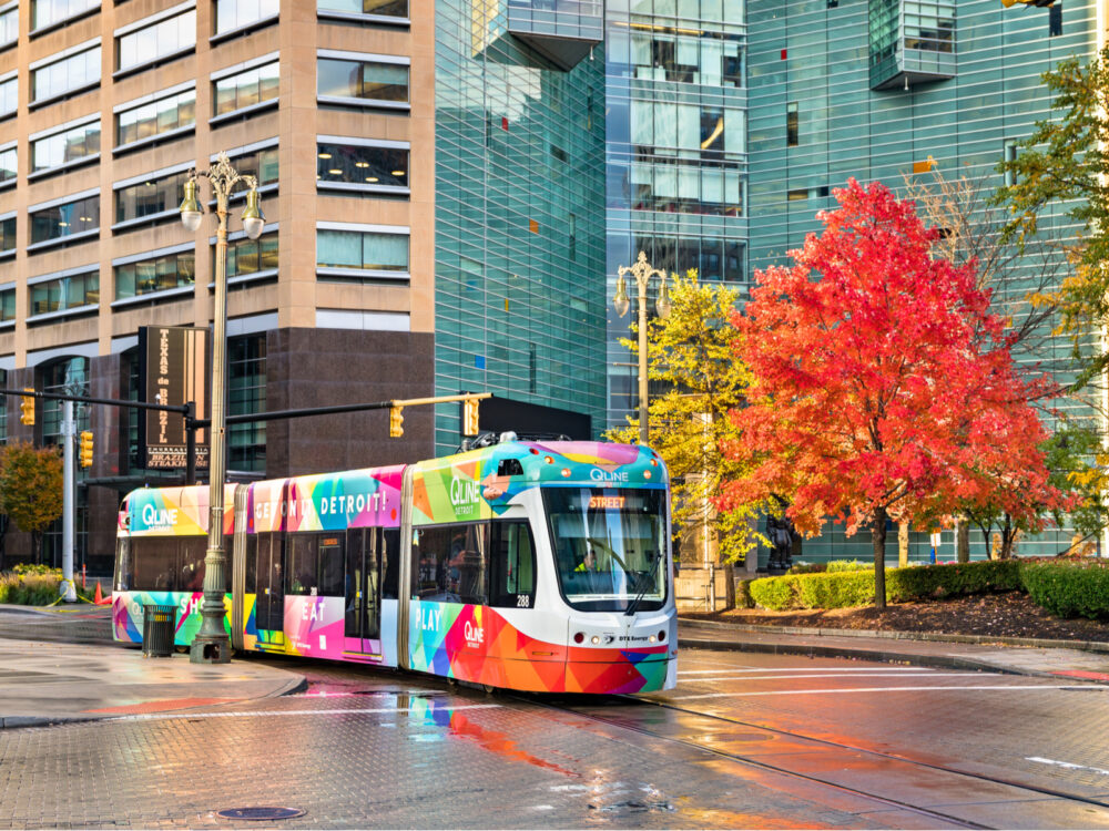 City tram going downtown with a colorful exterior during the gorgeous Fall season