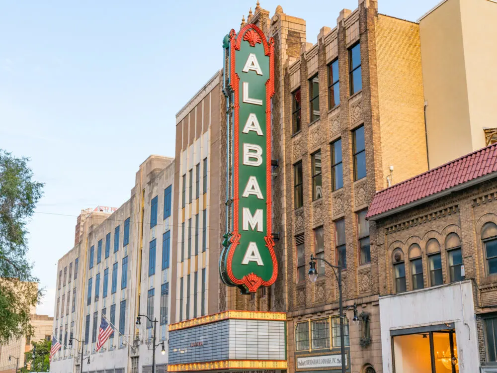 Birmingham Alabama theatre sign in green for a piece titled Is Birmingham Alabama Safe to Visit