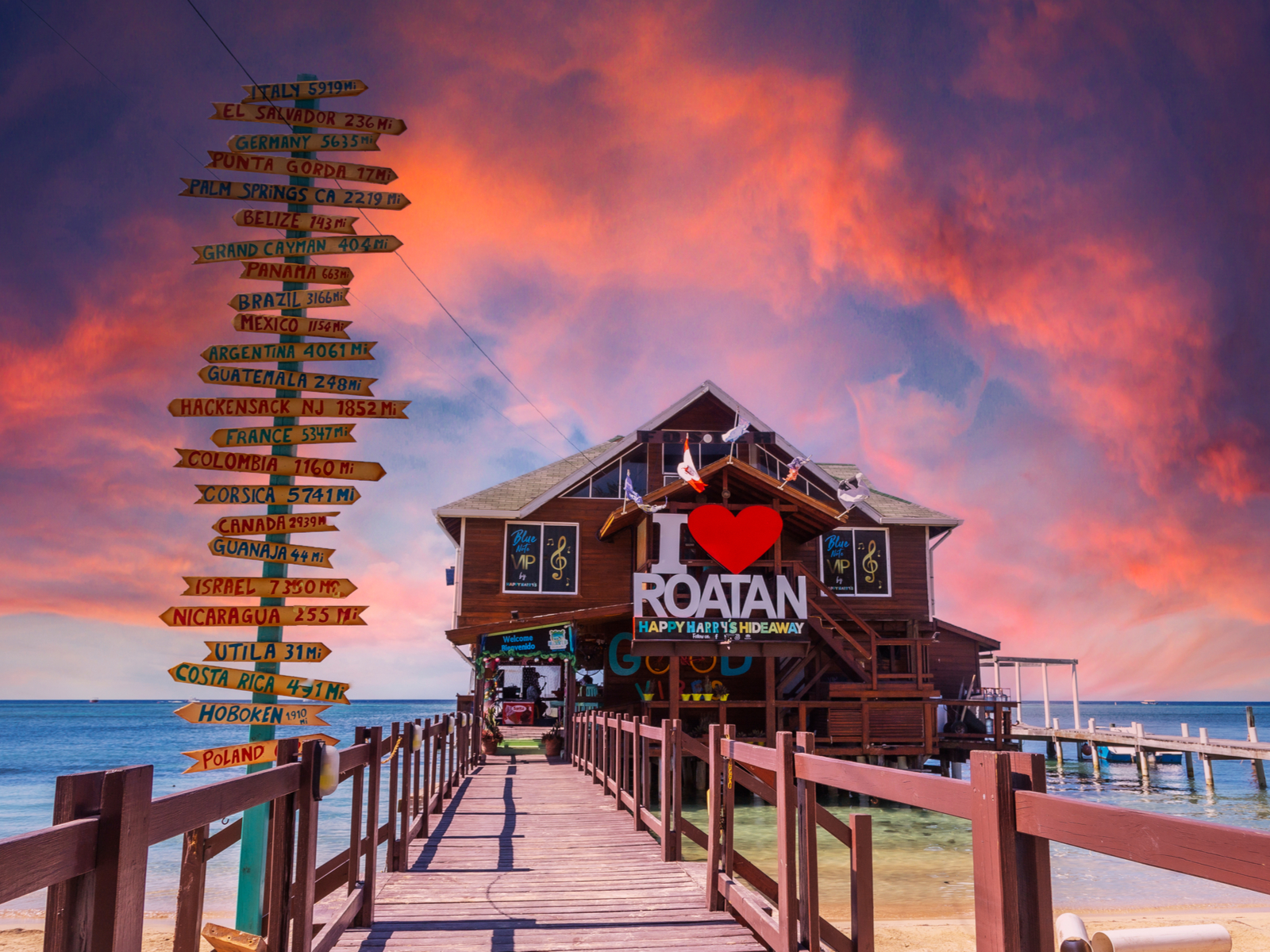 Over the water dive shop that says I heart Roatan