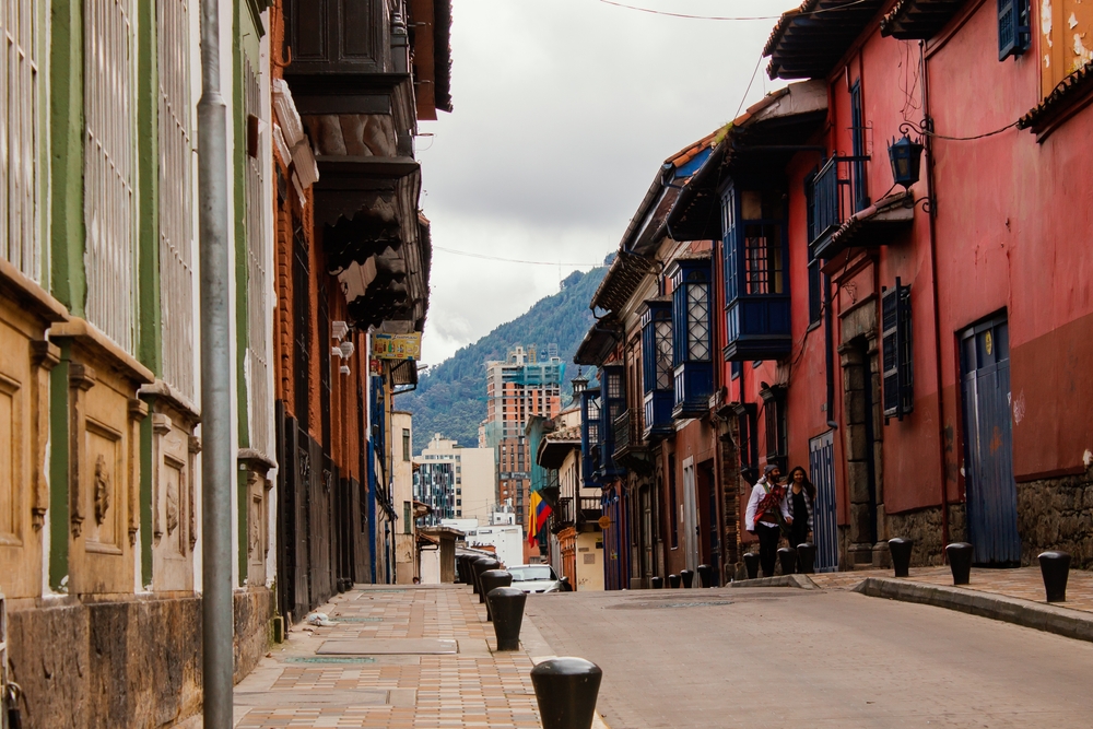 La Candelaria with buildings on the side of the street for a piece on Is Bogota Safe to Visit