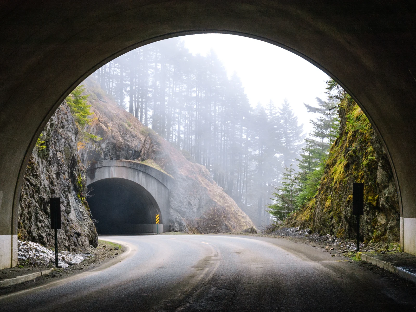 Tunnel under the mountain on a rainy day during the worst time to visit Olympic National Park
