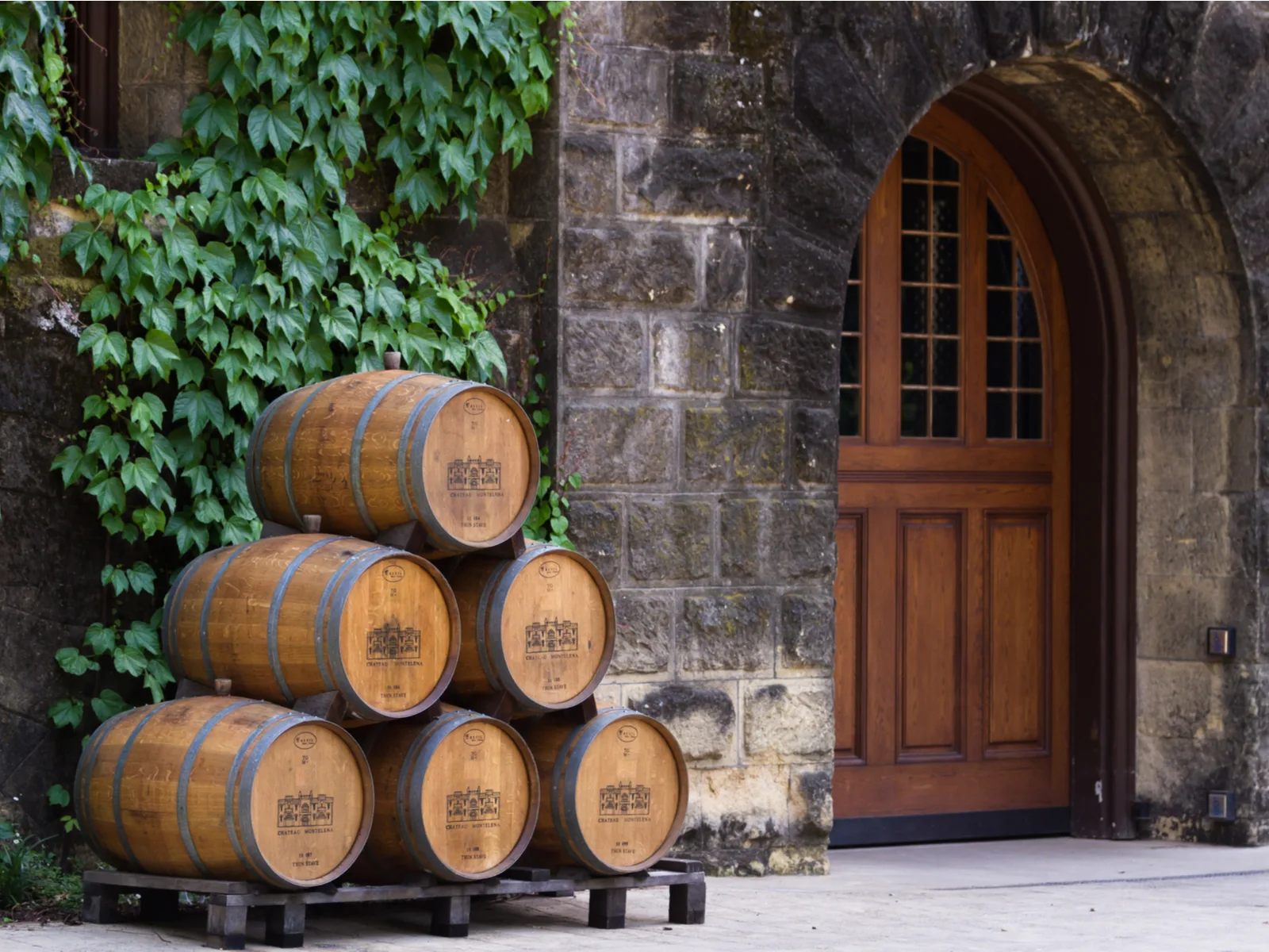 Calistoga, California - May 10 : Wine barrels stacked outside of the Chateau Montelena, May 10 2015 Calistoga, California.