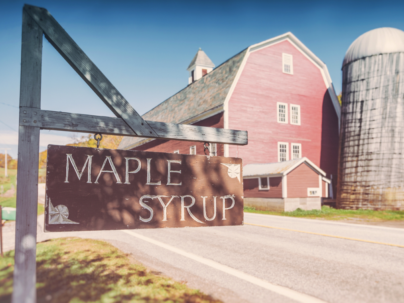 Sign at the entrance to a maple syrup farm pictured during the Spring, the least busy time to visit Vermont