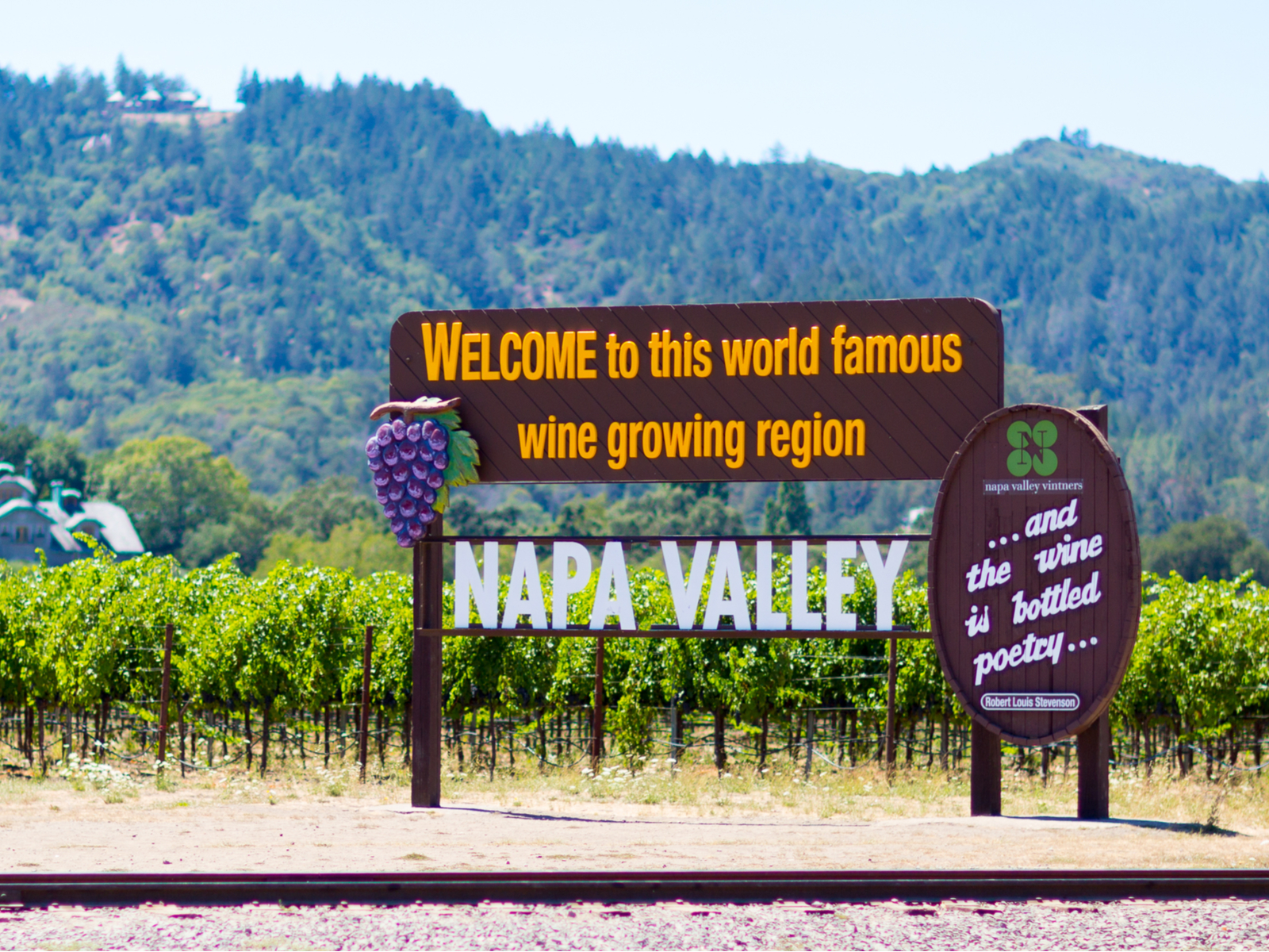 Welcome sign that says Welcome to this world famous wine growing region, as pictured during the best time to go to Napa