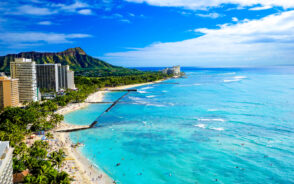 Aerial image of the Waikiki Beach and Diamond Head for a piece on the best things to do in Oahu