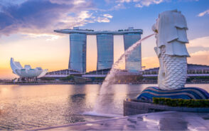 Monorail building in Singapore pictured with a fountain spitting water out of its mouth during the spring, the overall best time to visit Singapore