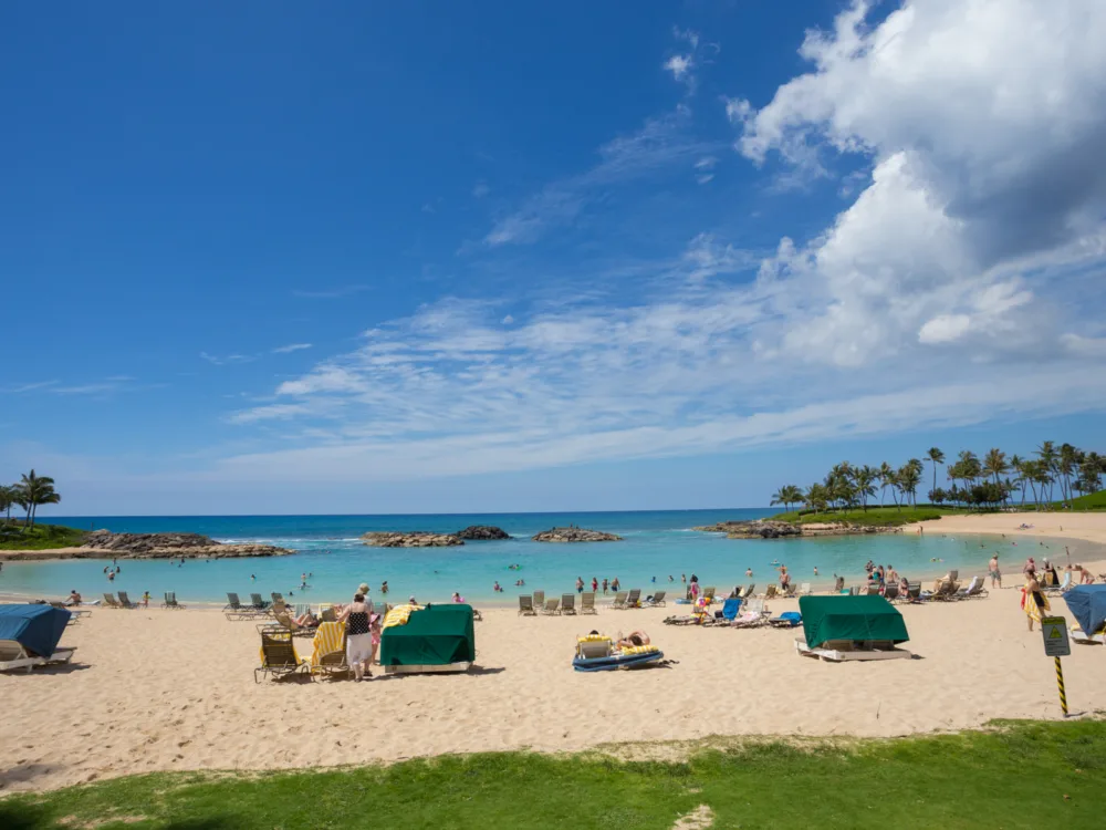 Tourists enjoying the manmade shore and pool at Ko Olina Lagoons, one of the best things to do in Oahu