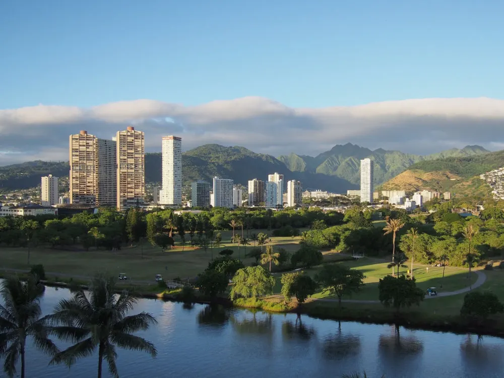 East Honolulu skyline with Ala Wai Canal in foreground for a piece on where to stay in Honolulu