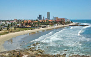 Image for a guide titled Is Mazatlan Safe to Visit featuring one of the beaches, as seen from an aerial point of view
