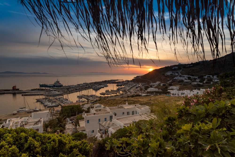 Tourlos, one of our favorite places when considering where to stay in Mykonos, pictured from the hillside at sunrise