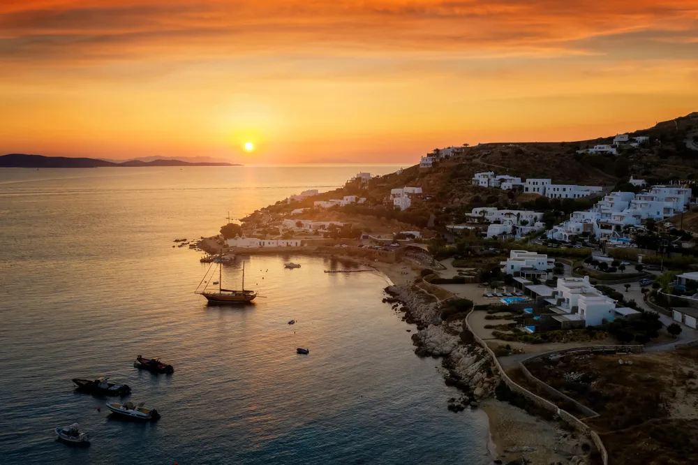 Agios Ioannis, one of the best places to stay in Mykonos, pictured from the air at sunset