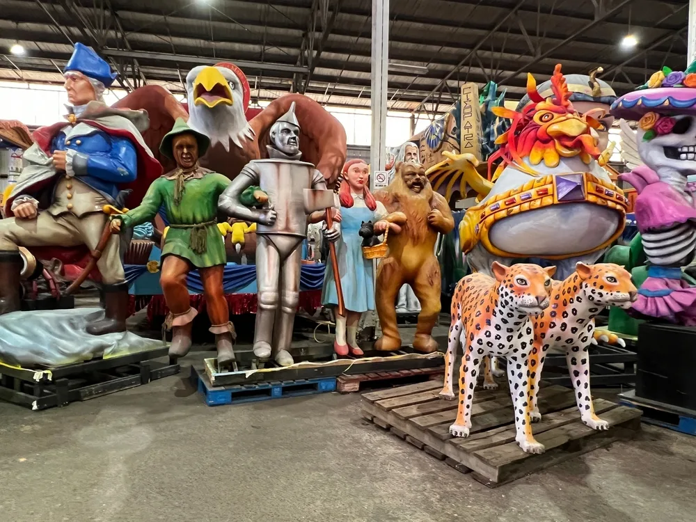 Life size figure of various characters and animals in a storage area in the Mardi Gras World, one of the best things to do in New Orleans.