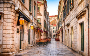 Photo of an old street with stone roads as a featured image for a piece on where to stay in Dubrovnik