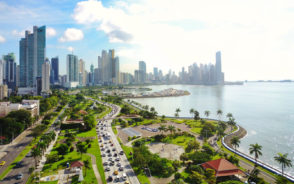 Featured image featuring an aerial shot of Panama City pictured along the coastline with blue skies during the best time to visit Panama