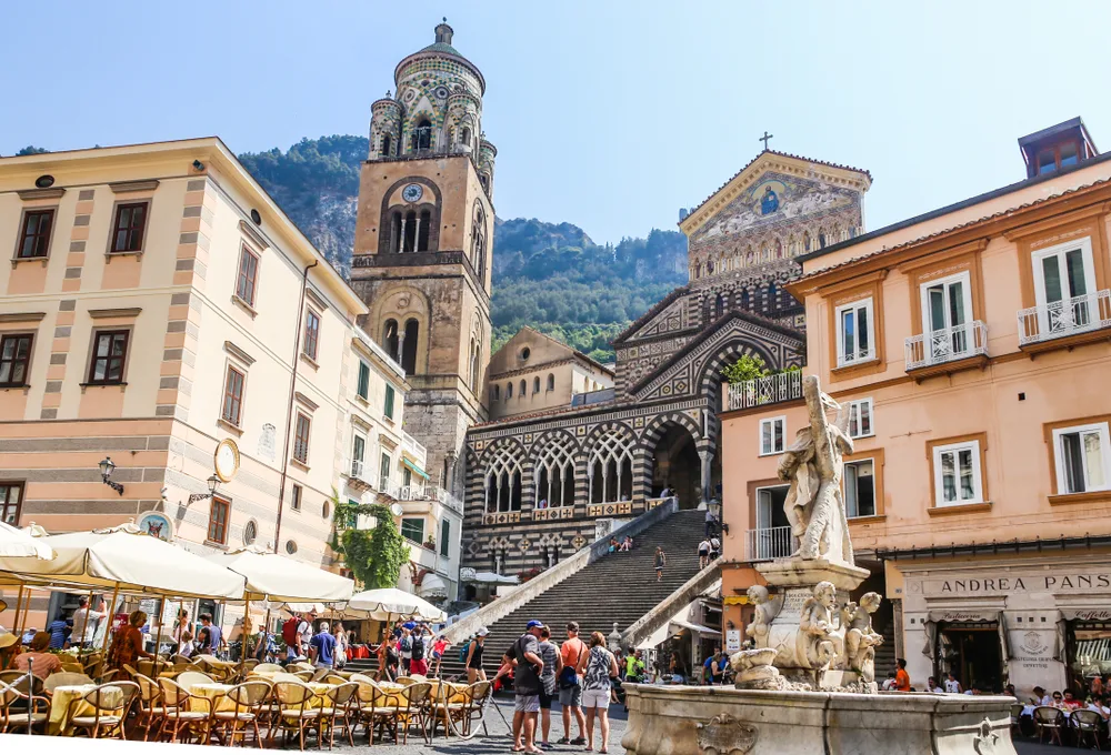 Amalfi town, one of our top picks when considering where to stay on the Amalfi Coast, pictured with historical buildings surrounding the city square