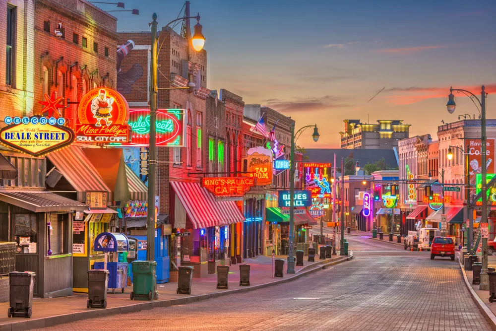 Iconic Beale Street in Memphis lit up at night for a frequently asked questions section on the best time to visit Tennessee