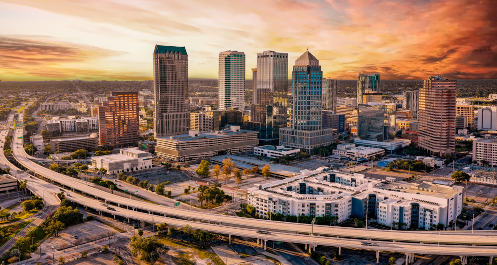 Aerial shot of downtown Tampa pictured at sunset for a piece on the where to stay in tampa