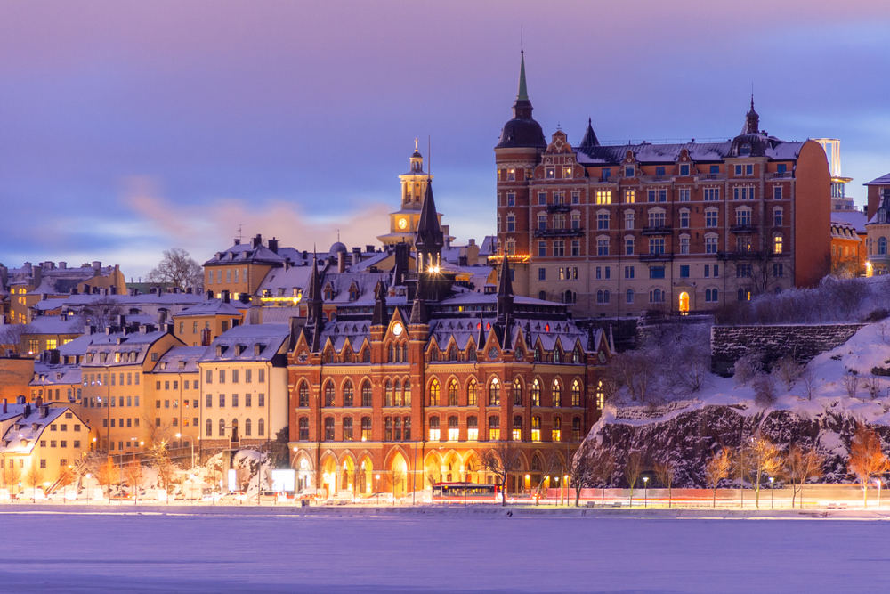 View of Stockholm old town with snow on the rooftops during winter, the least busy time to visit Sweden 