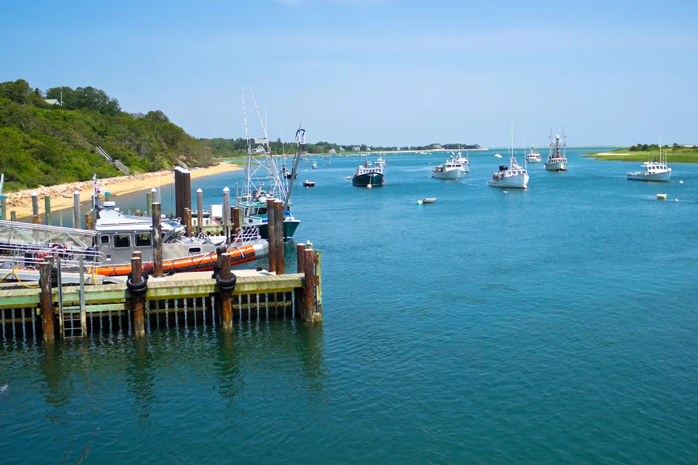 Boats moored by the fish pier in Chatham, one of our favorite places to stay in Cape Cod