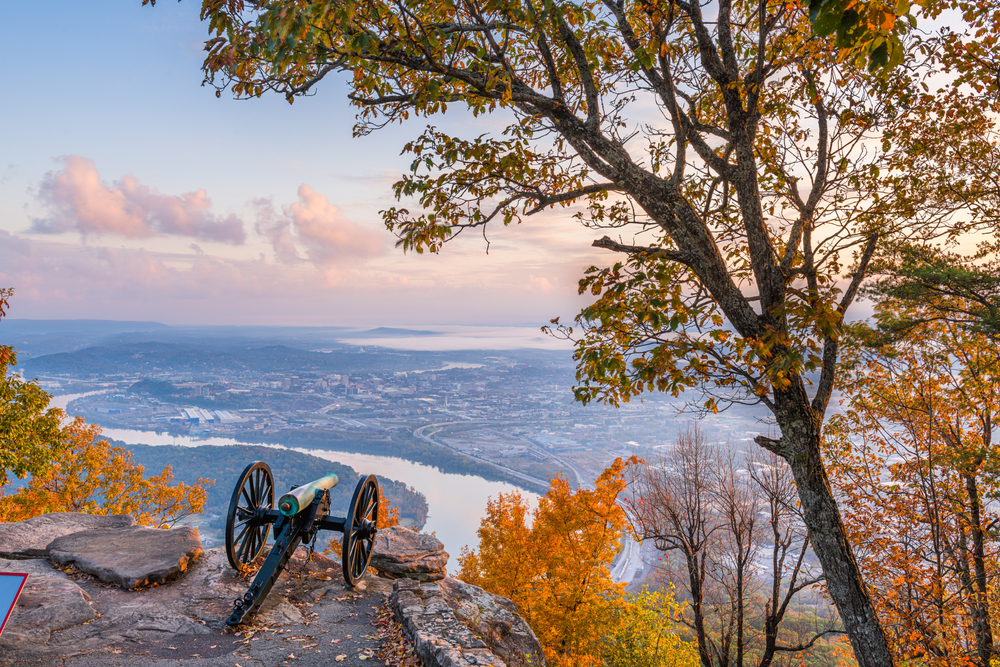View from Lookout Mountain in Chattanooga with cannon and vista view of the town during late fall showing the cheapest time to visit Tennessee
