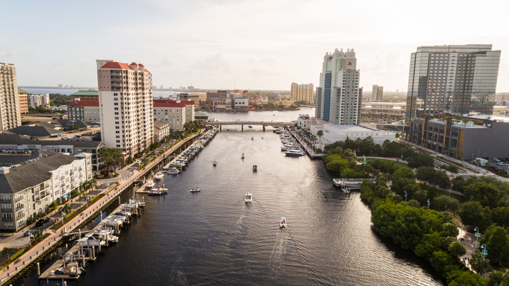 Aerial shot of one of the best places to stay in Tampa, Bay Harbor, pictured with boats moving down the canal
