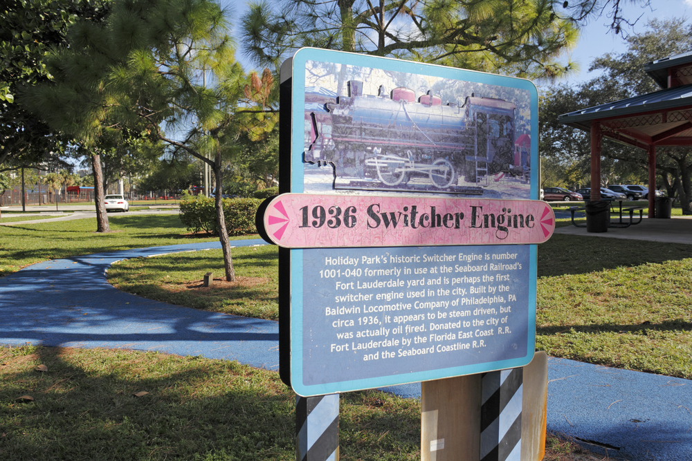 Unique sign that depicts the history of a locomotive in Holiday Park, one of the best places to stay in Fort Lauderdale