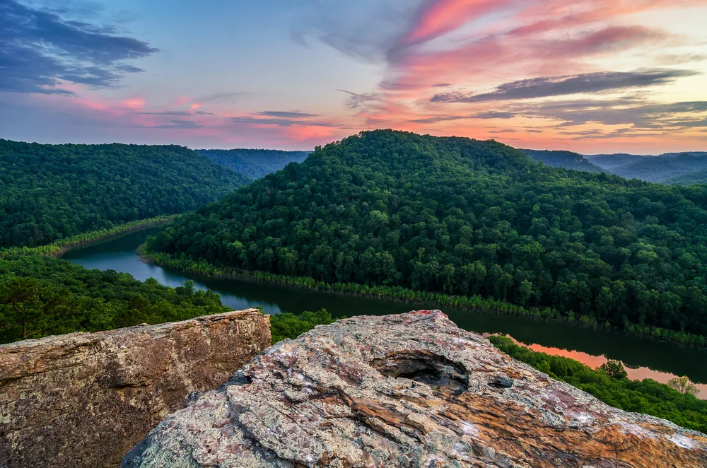 Colorful sunset over Big South Fork of the Cumberland River showing why you should visit Tennessee