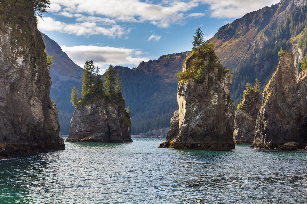 Kenai Fjords National Park, one of the best places to visit in Alaska, pictured from the view of a passenger on a boat