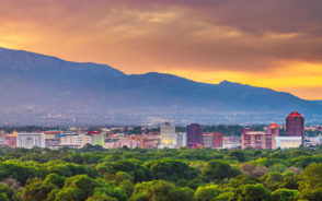 Gorgeous dusk view of the downtown cityscape during the overall best time to visit Albuquerque