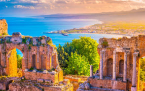 Oceanside ruins of the Taormina Theater pictured at dusk during the best time to visit Sicily